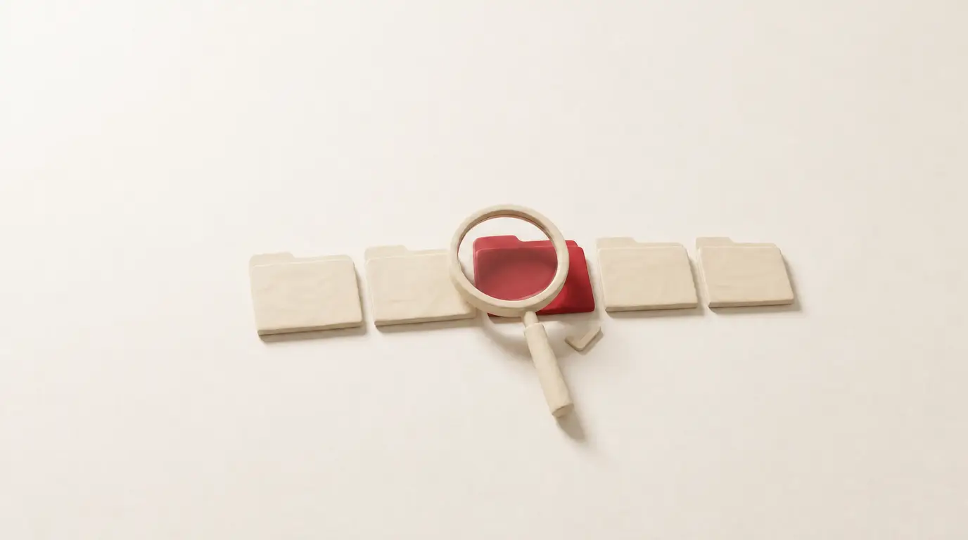 A row of five cream clay folders with a clay magnifying glass over the middle one, which is red, and a small clay tick beside it